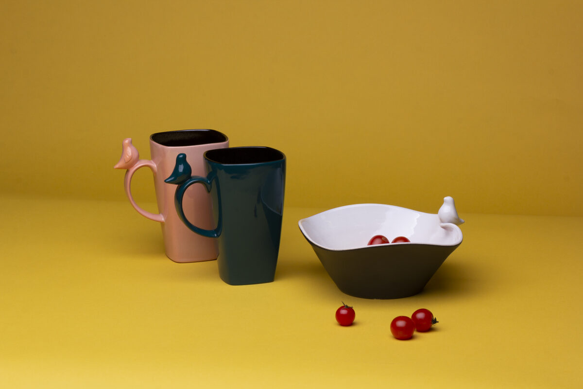 Large ceramic mug with bird figurine, teal