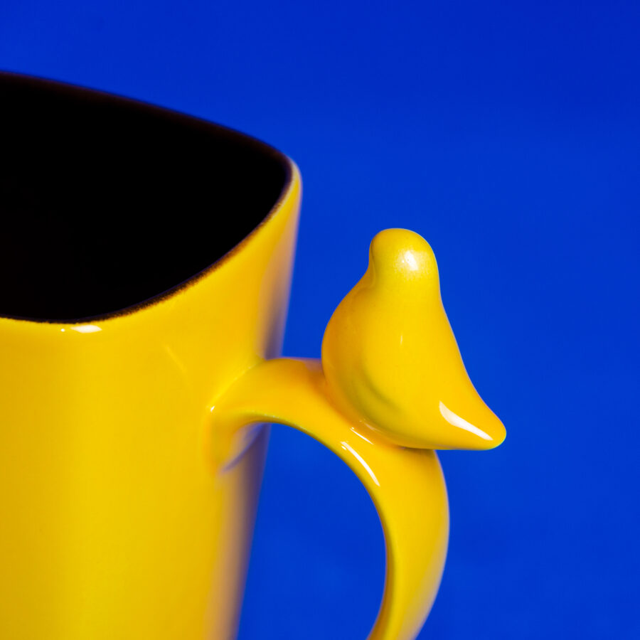 Large ceramic mug with bird figurine, lemon yellow