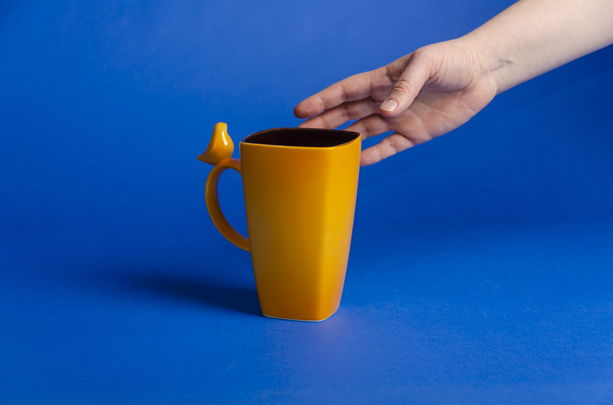 Large ceramic mug with bird figurine, orange blossom