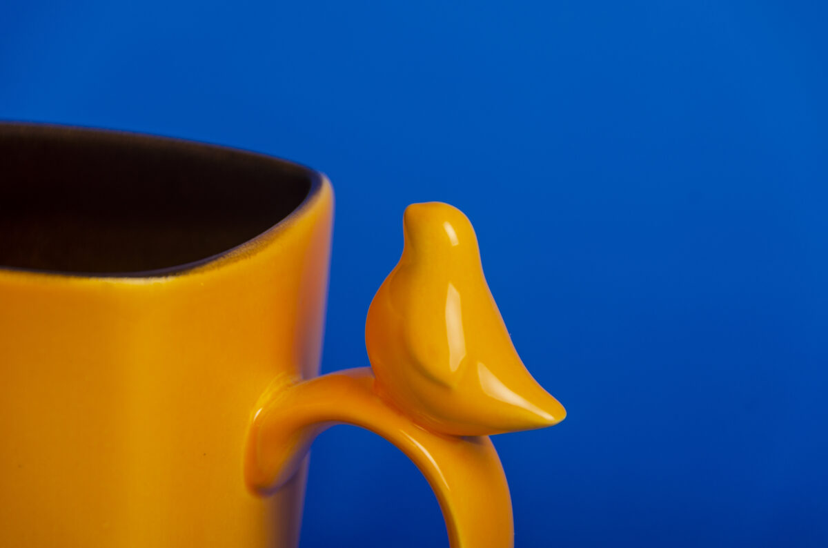 Large ceramic mug with bird figurine, orange blossom