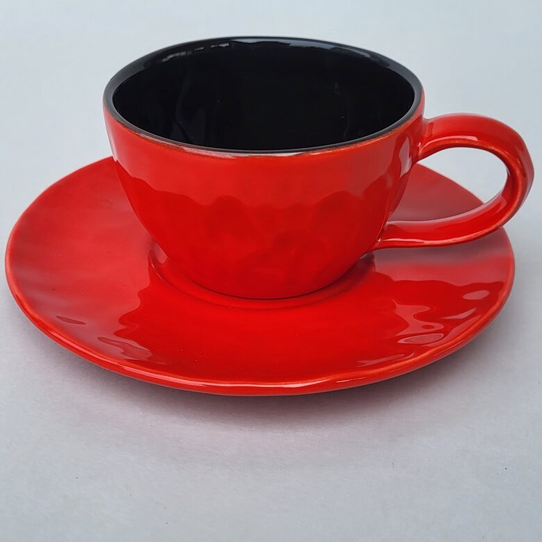 Coffee cup with saucer, orange